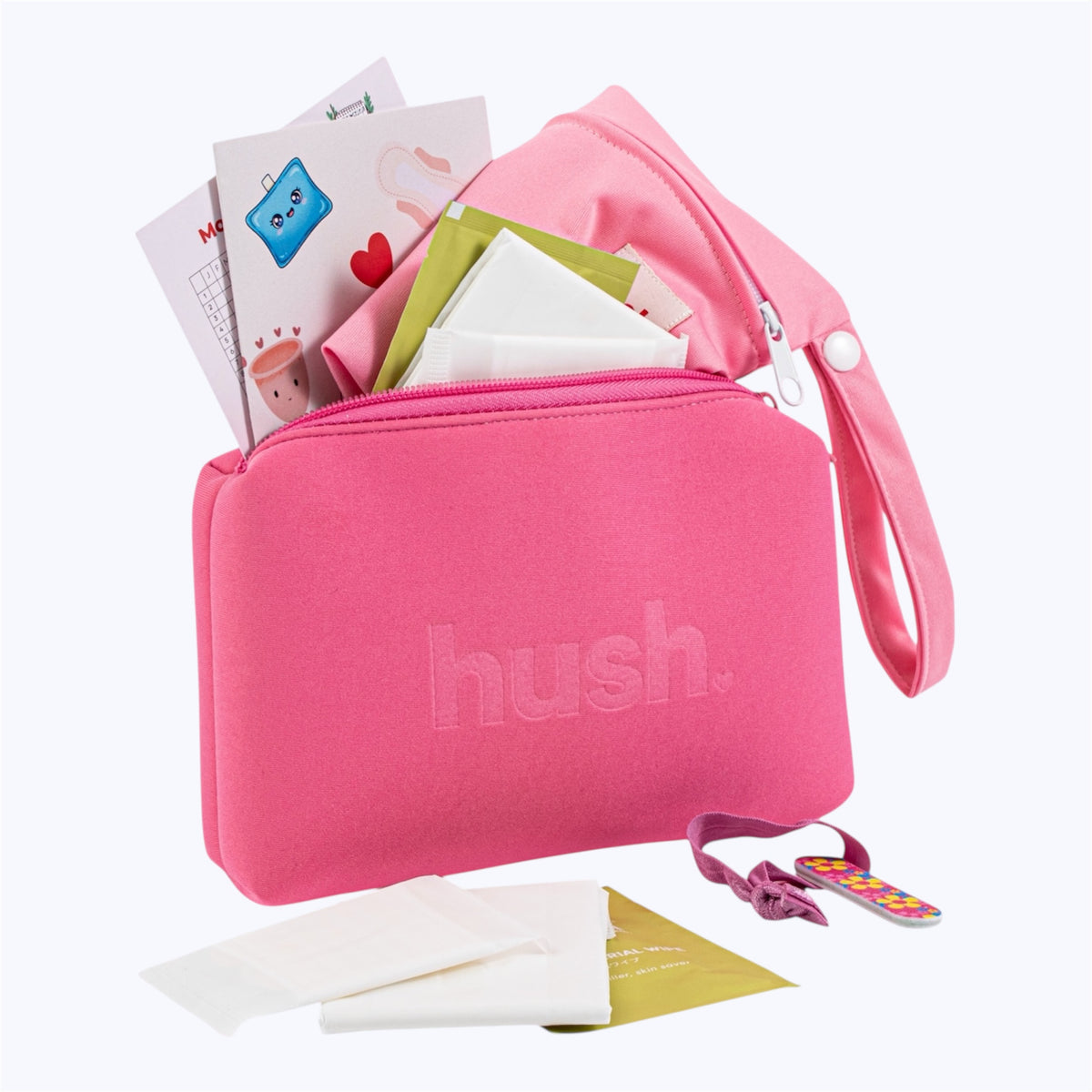 Pink pouch with hush logo embossed on it filled with period essentials including pads, liners, wipes, wet bag, hair tie, nail file.
