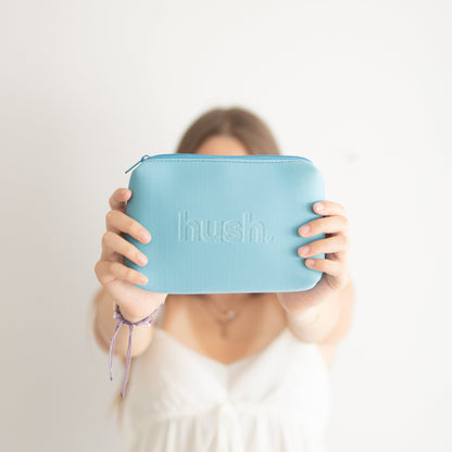 Young girl holding blue period kit