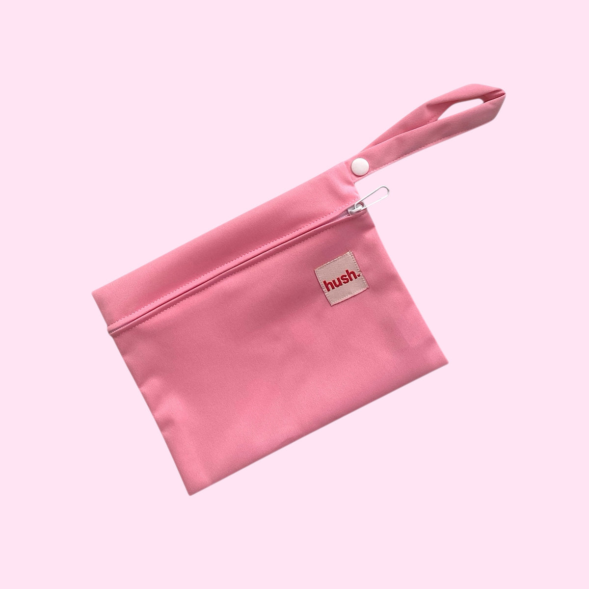 Pink Wet bag for period underwear or period items with hush logo on it