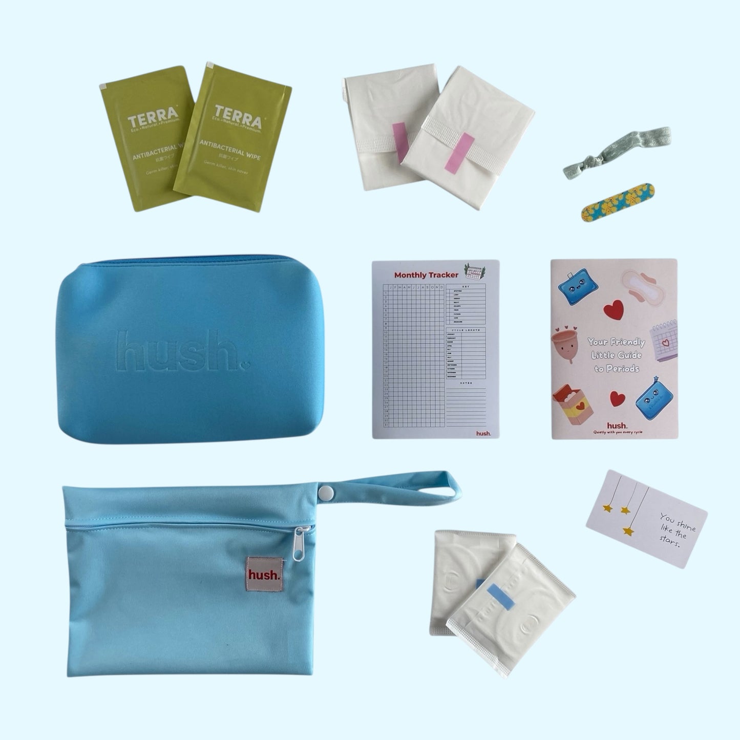 All the items found in first period kit. Wipes, pads, purse, monthly tracker, guide to periods, wet bag and liners